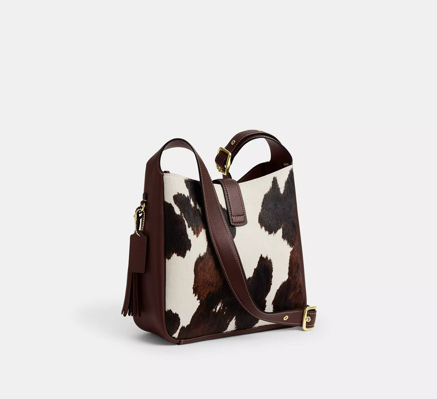 Hadley Convertible Crossbody Bag With Cow Print And Tassel Coach