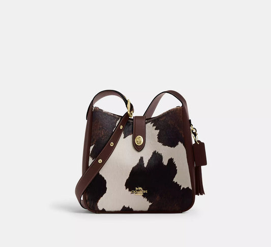 Hadley Convertible Crossbody Bag With Cow Print And Tassel Coach