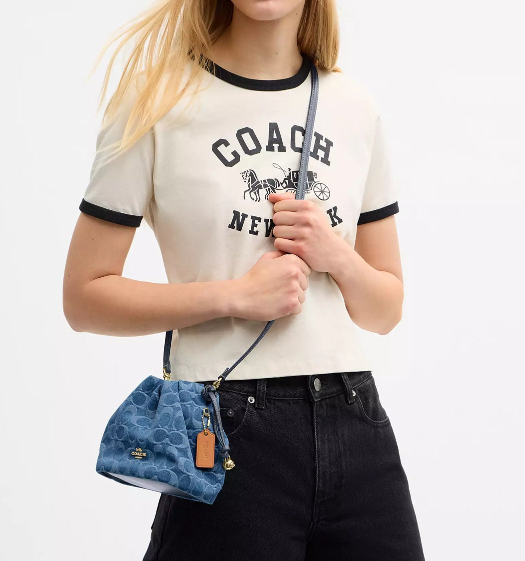 Faye Mini Drawstring Bag In Signature Denim Indigo Coach