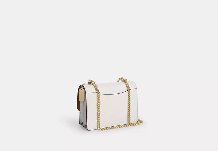 Klare Crossbody Bag In Signature Canvas Sand Chalk Coach