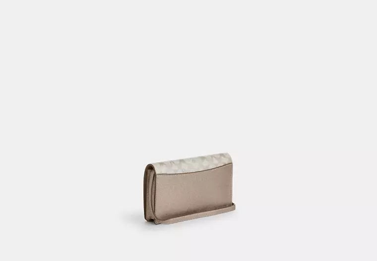 Anna Foldover Clutch Crossbody Bag In Signature Canvas Champagne Coach