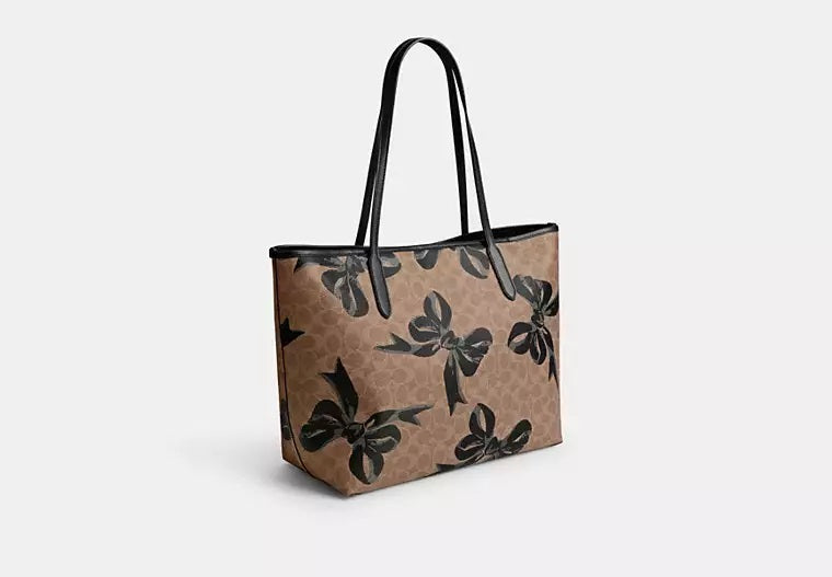 City Tote Bag In Signature Canvas With Bow Print Tan Black Coach