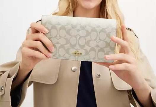 Anna Foldover Clutch Crossbody Bag In Signature Canvas Champagne Coach