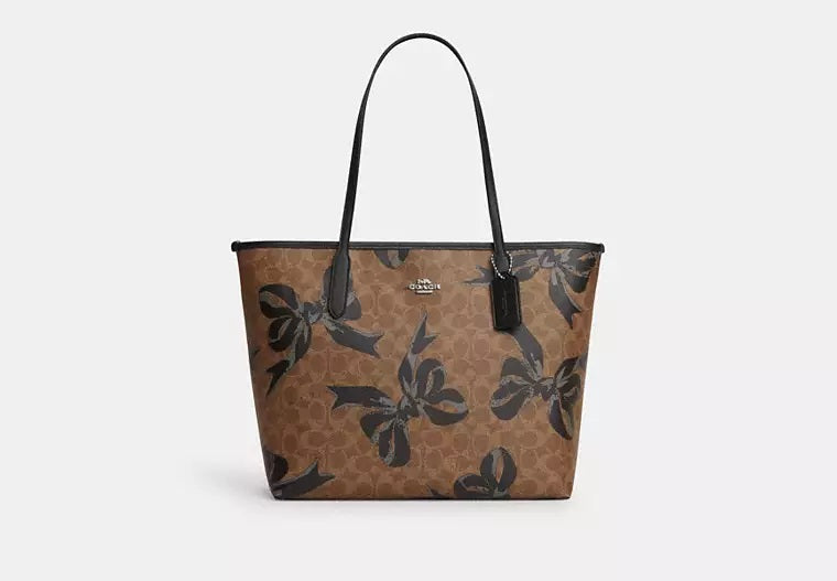 City Tote Bag In Signature Canvas With Bow Print Tan Black Coach