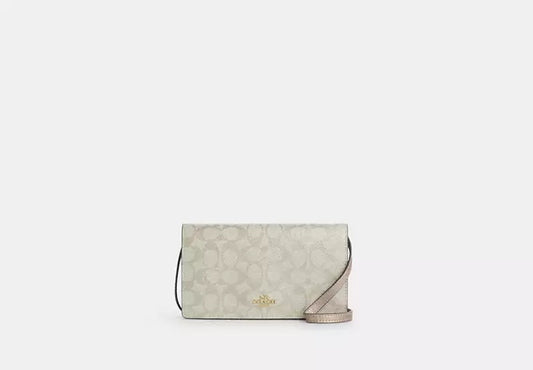 Anna Foldover Clutch Crossbody Bag In Signature Canvas Champagne Coach