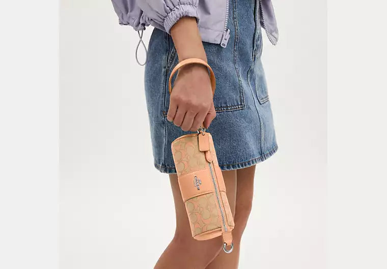 Nolita Barrel Bag In Signature Jacquard Faded Blush Coach