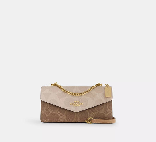Klare Envelope Crossbody Bag In Blocked Signature Canvas Sand Tan Coach